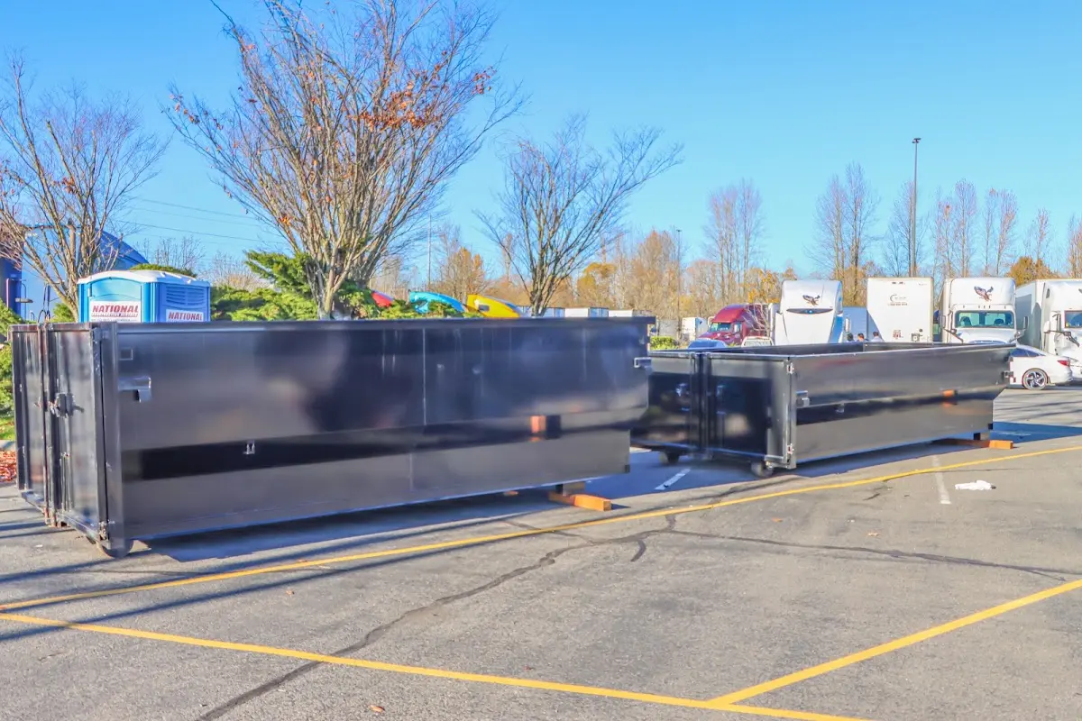 Professional dumpster rental service with roll-off container on residential driveway in Southgate